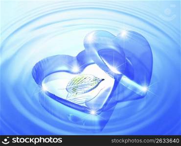 Blue heart shapeed tray with a leaf inside, laying on rippled blue water