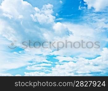 blue heaven vith sparse cumulus clouds