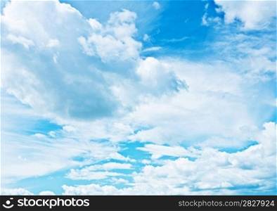 blue heaven vith sparse cumulus clouds