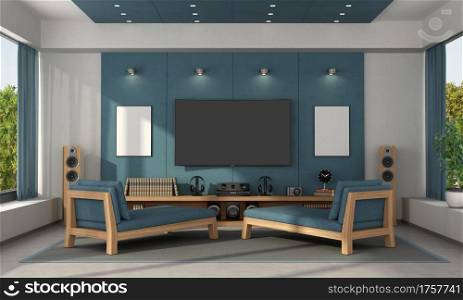 Blue home cinema of a modern villa with tv set on concrete panels and two chaise lounges - 3d rendering. Blue home cinema of a modern villa
