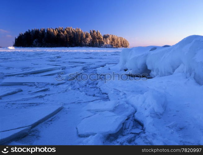 Blue ice floating and a small island in the lake