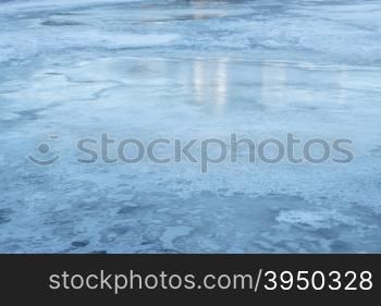blue ice texture - frozen lake with reflections