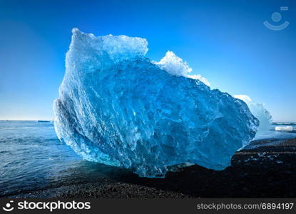 blue iceberg in Jokulsarlon, a large glacier lake in south Iceland, selective focus,