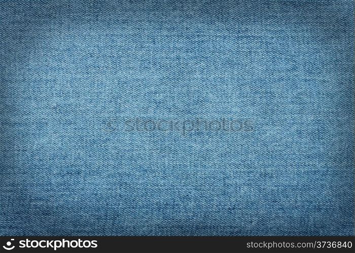 Blue jeans background with smooth dark contour