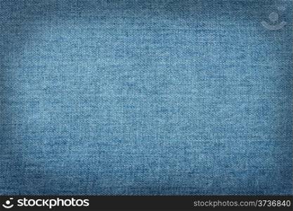 Blue jeans background with smooth dark contour