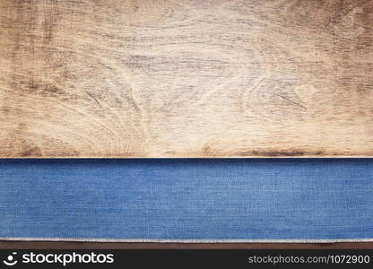 blue jeans texture on wooden background