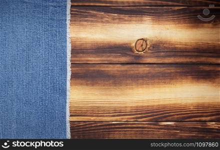 blue jeans texture on wooden background surface