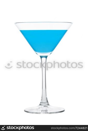 Blue lagoon cocktail with vodka and blue curacao liqueur in martini glass isolated on white.