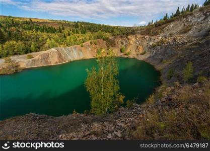 Blue lake in Altai. This is a former copper mine that was flooded with water. Blue lake in Altai. Blue lake in Altai