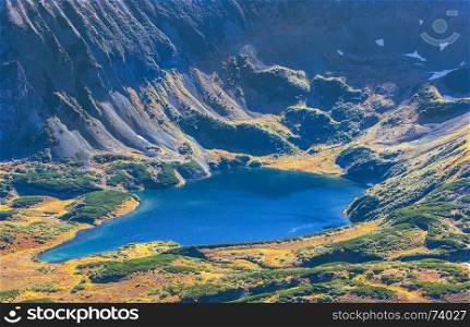 Blue lake in the crater of an extinct volcano in Kamchatka