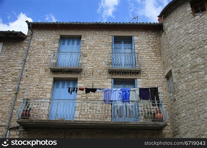 Blue laundry on a balcony in France