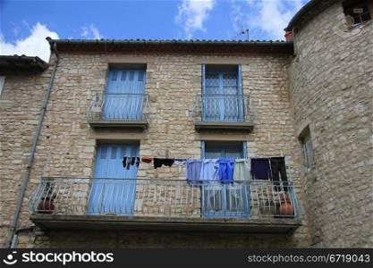 Blue laundry on a balcony in France