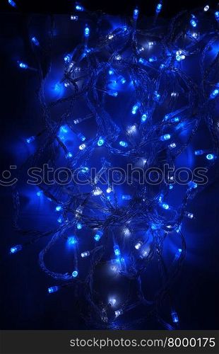 Blue lighting background, blue decorative garland