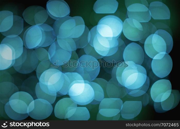 Blue lights defocused abstract backgrounds from lens bokeh effect, A group of lights defocused blurred background
