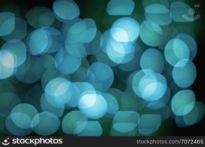 Blue lights defocused abstract backgrounds from lens bokeh effect, A group of lights defocused blurred background