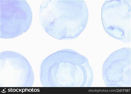blue liquid color blobs painted white canvas