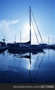 blue marina sunset boats with water reflection nautical view