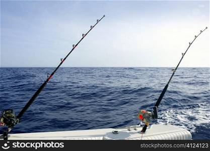 Blue Mediterranean fishing boat with rod and reels