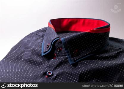 blue men&rsquo;s shirt with white spots on white background