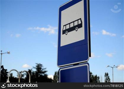 Blue metal sign of a bus stop