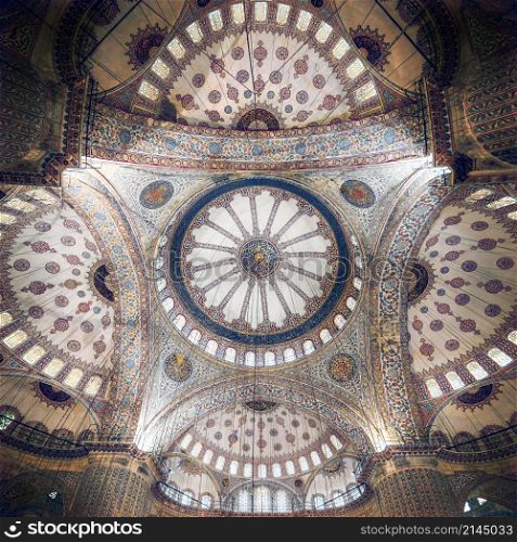 Blue Mosque interior. Also know as the Sultan Ahmed Mosquei n Istanbul, Turkey. Blue Mosque intricate ceiling