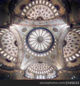 Blue Mosque interior. Also know as the Sultan Ahmed Mosquei n Istanbul, Turkey. Blue Mosque intricate ceiling