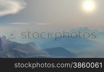Blue mountain peaks shrouded in a thick white mist. Camera swiftly flies over the mountains. Fast floating clouds, bright white sun sinks toward the horizon, a little dissipating fog.