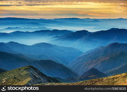 Blue mountains and hills over beautiful sunset