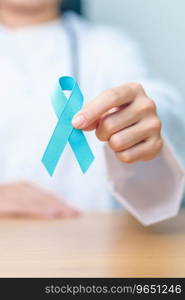 Blue November Prostate Cancer Awareness month, Doctor with Blue Ribbon in hospital for support people life and illness. Healthcare, International men, Father, Diabetes and World cancer day