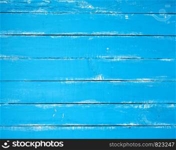 blue old wooden background with cracked paint, parallel boards, full frame