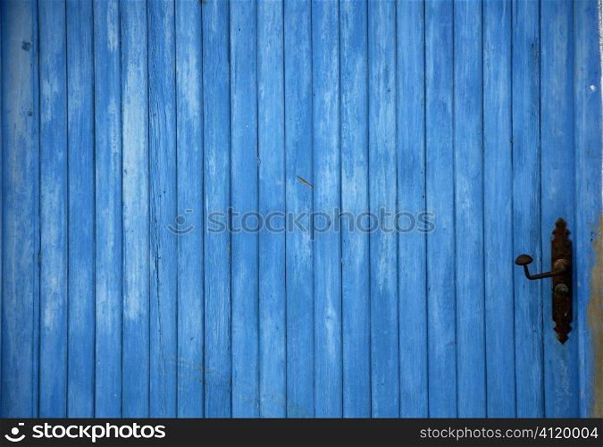 Blue old wooden door detail with handle
