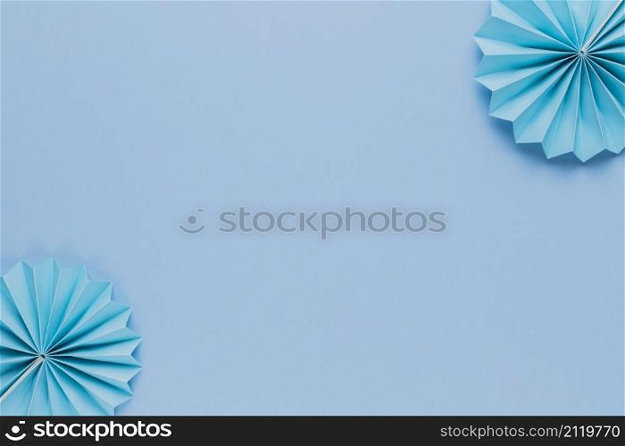 blue origami paper fan corner blue backdrop