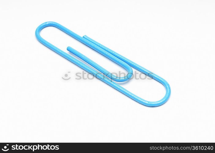 Blue paper clip on white background