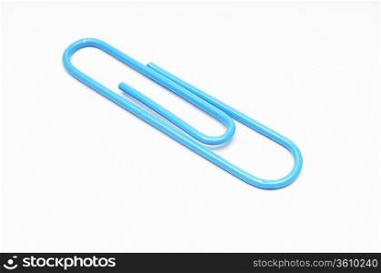Blue paper clip on white background