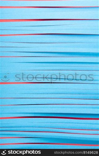 Blue paper strips background. Blue paper strips on red.