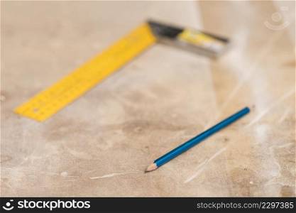 blue pencil blurred ruler wooden surface