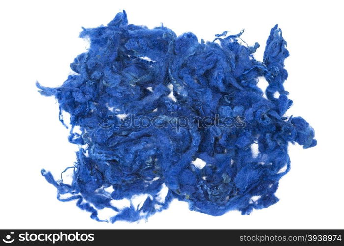 Blue piece of Australian sheep wool Merino breed close-up on a white background. Blue piece of Australian sheep wool Merino breed close-up on a white background.