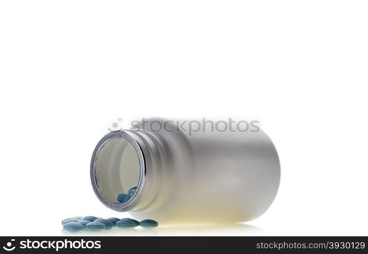 Blue pills an pill bottle on isolated background. Blue pills an pill bottle on isolated white background