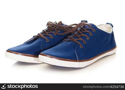 blue plimsolls cut out from white background
