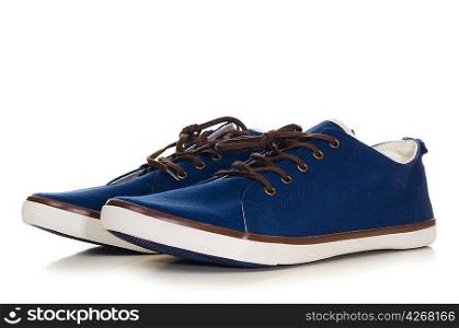 blue plimsolls cut out from white background