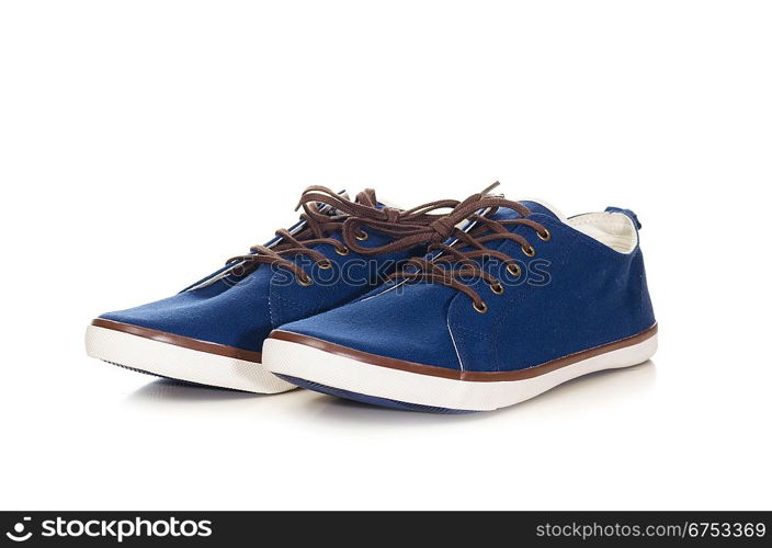 blue plimsolls cut out from white background