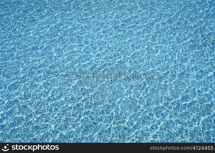 Blue pool water transparent texture reflexion and waves