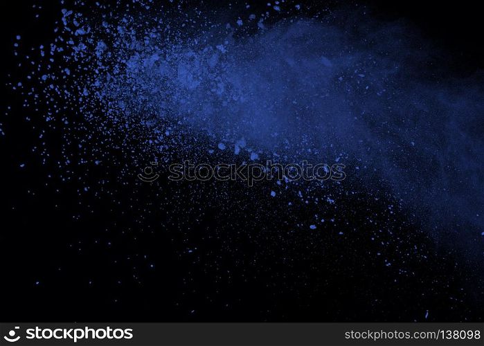 Blue powder explosion on black background. Colored cloud. Color dust explode. Paint Holi.