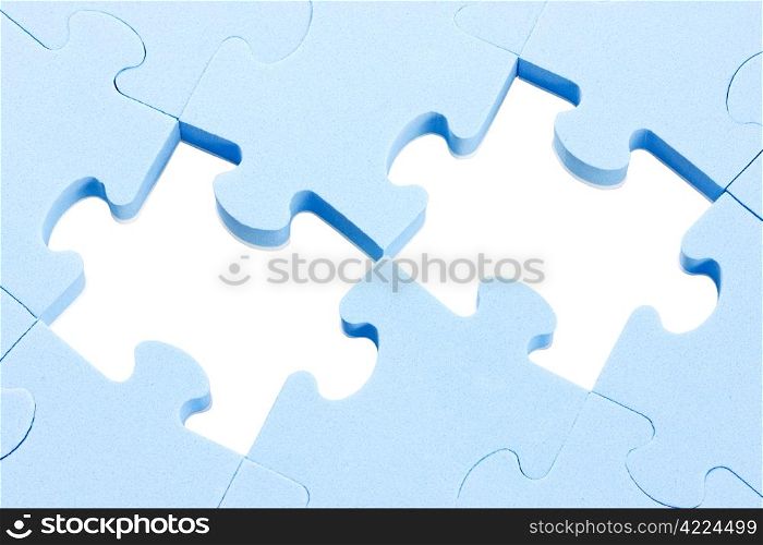 blue puzzle background with two missing pieces