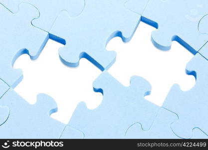 blue puzzle background with two missing pieces