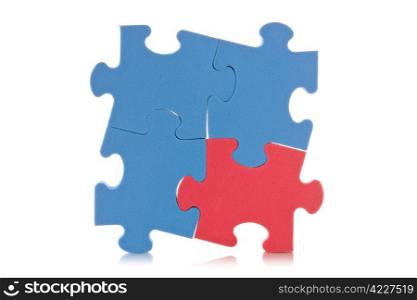 blue puzzle sign with one red piece