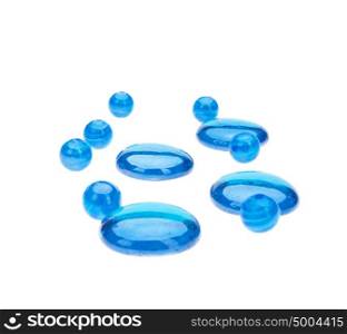 Blue round beads and pebbles isolated on white