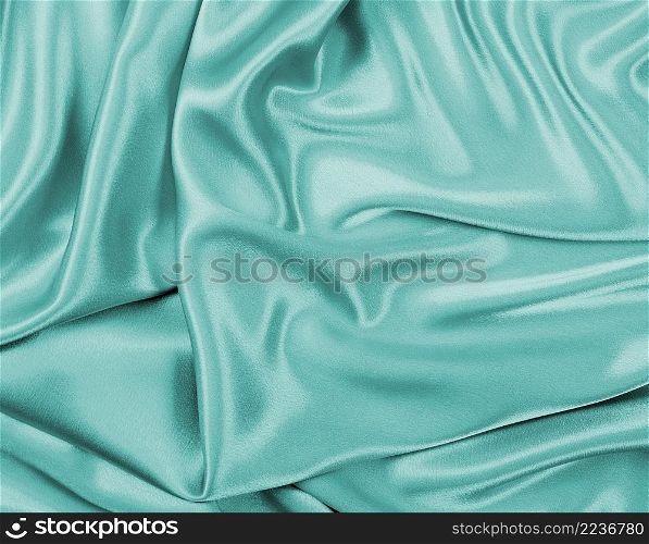 Blue satin textile background close up. Blue satin textile background