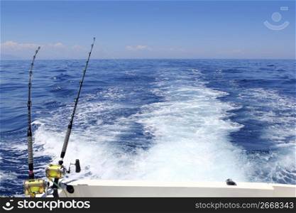 blue sea fishing sunny day trolling rod reels wake ocean big game