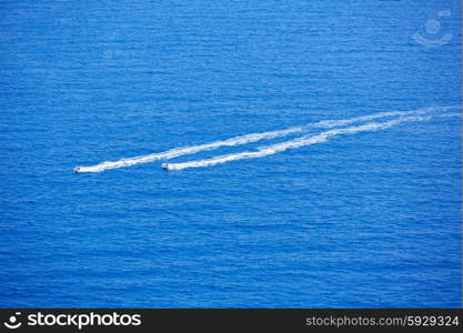 Blue sea ocean with watercrafts wash wake aerial view in Mediterranean